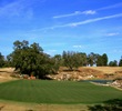 The par-3 eighth hole on the the Rolling Oaks at World Woods Golf Club's plays downhill to a green guarded by water.