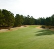 The ninth hole on the Pine Barrens course at the World Woods Golf Club is guarded by bunkers and plays to an elevated green. 