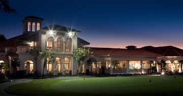 A view of the clubhouse and putting green at Avila Golf & Country Club